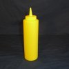 A yellow plastic mustard bottle purchased from any local grocery or department store. 

Any plastic bottle with a small enough tip to fit through the bottom hole in the glass window will work fine.

Attach a 6 inch piece of 1/4 inch (OD) vinyl tubing to the end of the bottle for accessing more difficult windows or through the sides of tempered glass or patio doors.